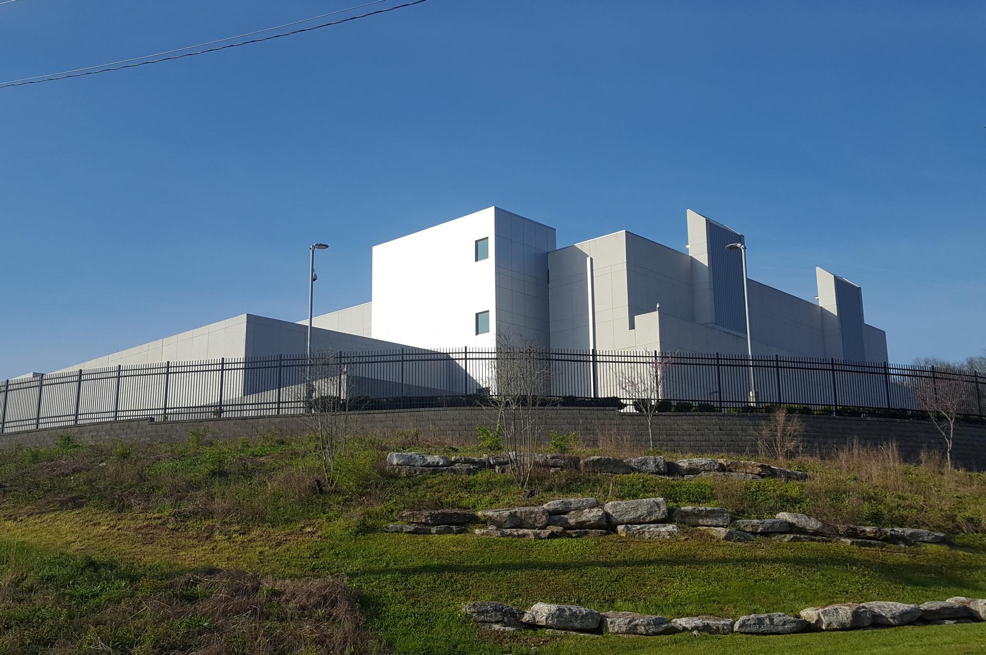 Secure data center facility sits atop a hilly raised plinth
